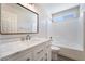 Bathroom featuring a modern vanity, shower over tub, and ample light at 844 Binbrook Dr, Henderson, NV 89052