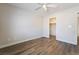 An empty bedroom featuring light colored walls, hardwood floors, and an open closet at 844 Binbrook Dr, Henderson, NV 89052