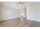 Spacious bedroom featuring neutral walls, wood-look flooring, and ceiling fan at 844 Binbrook Dr, Henderson, NV 89052
