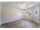 Bright bedroom with windows and wood-look flooring at 844 Binbrook Dr, Henderson, NV 89052