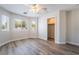 Bedroom featuring wood-look floors, a ceiling fan, and natural light at 844 Binbrook Dr, Henderson, NV 89052