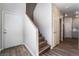 Inviting entryway showcasing new wood flooring, a staircase, and a white front door at 844 Binbrook Dr, Henderson, NV 89052
