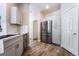 Well-lit kitchen featuring stainless steel appliances, quartz countertops, and updated cabinets at 844 Binbrook Dr, Henderson, NV 89052