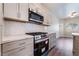 Updated kitchen features quartz countertops, stainless appliances, and modern cabinetry at 844 Binbrook Dr, Henderson, NV 89052