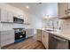 Spacious kitchen features modern appliances, quartz countertops, and ample cabinet space at 844 Binbrook Dr, Henderson, NV 89052
