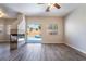 The bright living room features a fireplace, ceiling fan, and sliding glass door access to the pool at 844 Binbrook Dr, Henderson, NV 89052