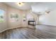Spacious living area featuring a fireplace, sleek flooring, and ample natural light from well-placed windows at 844 Binbrook Dr, Henderson, NV 89052