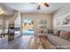 Bright living room with fireplace and access to the backyard pool area through sliding glass doors at 844 Binbrook Dr, Henderson, NV 89052