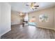 Spacious living area with wood floors, a corner fireplace, and a bright view of the backyard pool at 844 Binbrook Dr, Henderson, NV 89052