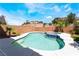 Backyard view of a swimming pool and hot tub enclosed by a brick fence at 844 Binbrook Dr, Henderson, NV 89052