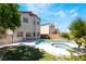 Backyard pool and lawn area, viewed from the house under a partially cloudy sky at 844 Binbrook Dr, Henderson, NV 89052