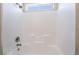 Clean white shower with chrome fixtures and tiled surround at 844 Binbrook Dr, Henderson, NV 89052