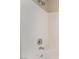 Close-up of showerhead and controls in a clean, white tiled shower at 844 Binbrook Dr, Henderson, NV 89052