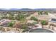Aerial view of a beautiful home and neighborhood with desert landscaping and mountain views at 8945 S Tenaya Way, Las Vegas, NV 89113