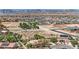 Expansive aerial view of a desert community with mountain views, desert landscape, and a variety of single-Gathering homes at 8945 S Tenaya Way, Las Vegas, NV 89113