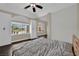Spacious bedroom with hardwood floors and bright windows at 8945 S Tenaya Way, Las Vegas, NV 89113