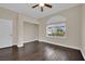 Well-lit bedroom featuring wood floors, modern ceiling fan, and neutral walls at 8945 S Tenaya Way, Las Vegas, NV 89113