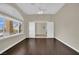 Empty bedroom with hardwood floors, natural light, and white trim at 8945 S Tenaya Way, Las Vegas, NV 89113