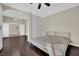 Large bedroom with hardwood floors, natural light, and open doorway at 8945 S Tenaya Way, Las Vegas, NV 89113