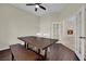 Dining room with hardwood floors, large table, and access to the living room at 8945 S Tenaya Way, Las Vegas, NV 89113