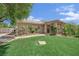 Charming home with well-maintained front yard, desert landscaping, and a welcoming entrance at 8945 S Tenaya Way, Las Vegas, NV 89113