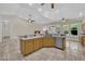 Open kitchen with stainless steel appliances, granite countertops, and tile flooring at 8945 S Tenaya Way, Las Vegas, NV 89113