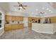 Spacious kitchen featuring ample cabinetry, granite counters, and stainless steel appliances at 8945 S Tenaya Way, Las Vegas, NV 89113