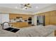 Kitchen featuring stainless steel appliances, granite countertops, and wooden cabinets at 8945 S Tenaya Way, Las Vegas, NV 89113
