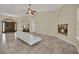 Open living area with travertine floors, fireplace, and archway to the dining room at 8945 S Tenaya Way, Las Vegas, NV 89113