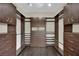 Organized walk-in closet with custom shelving and ample storage space at 8945 S Tenaya Way, Las Vegas, NV 89113