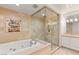 Bright bathroom featuring a soaking tub and separate glass shower at 9101 Alta Dr # 706, Las Vegas, NV 89145