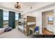 Bedroom featuring a bunk bed, desk, and large windows with city views at 9101 Alta Dr # 706, Las Vegas, NV 89145