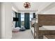 Bedroom featuring a bunk bed, ceiling fan, and large windows with city views at 9101 Alta Dr # 706, Las Vegas, NV 89145