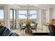 An elegant dining room with floor to ceiling windows with an incredible view and a decorative chandelier at 9101 Alta Dr # 706, Las Vegas, NV 89145