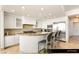 Bright kitchen features stainless steel appliances, an island with barstool seating, and ample storage at 9101 Alta Dr # 706, Las Vegas, NV 89145