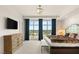 Bright main bedroom with ample natural light, a comfortable bed, city views, and stylish furnishings at 9101 Alta Dr # 706, Las Vegas, NV 89145