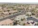 Expansive aerial view showcasing a vibrant neighborhood with well-maintained homes and lush landscaping at 9373 Oxbow Lake Ave, Las Vegas, NV 89149