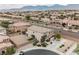 Aerial view of a two-story home showcasing backyard, landscaping, and neighborhood surroundings at 9373 Oxbow Lake Ave, Las Vegas, NV 89149