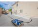 Backyard featuring a basketball court, vintage-style signs, and a cornhole game at 9373 Oxbow Lake Ave, Las Vegas, NV 89149