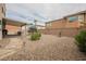 Backyard with patio furniture, a trampoline, drought resistant landscaping, and rock ground cover at 9373 Oxbow Lake Ave, Las Vegas, NV 89149