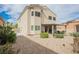 Spacious backyard featuring a covered patio, landscaping, and room for outdoor activities at 9373 Oxbow Lake Ave, Las Vegas, NV 89149