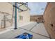 Backyard featuring a basketball court, vintage-style signs, and a cornhole game at 9373 Oxbow Lake Ave, Las Vegas, NV 89149