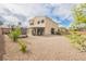 Spacious backyard featuring a covered patio, landscaping, and room for outdoor activities at 9373 Oxbow Lake Ave, Las Vegas, NV 89149