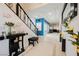 Elegant entryway with stylish decor, a staircase, and tile flooring with decorative border at 9373 Oxbow Lake Ave, Las Vegas, NV 89149