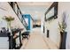 Bright entryway featuring tile flooring, black accents, and decorative furnishings at 9373 Oxbow Lake Ave, Las Vegas, NV 89149