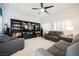 Cozy living room with plush seating, built-in shelving, and bright natural light at 9373 Oxbow Lake Ave, Las Vegas, NV 89149