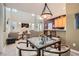 Inviting dining area with views of the living room and kitchen, complete with stylish lighting and comfortable seating at 939 Paisley St, Las Vegas, NV 89145