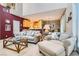 Spacious living room featuring a comfortable seating area and seamless transition to the kitchen and dining area at 939 Paisley St, Las Vegas, NV 89145