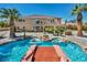 Stunning backyard oasis featuring a large pool, spa, and lush landscaping at 9504 Empire Rock St, Las Vegas, NV 89143