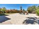 Spacious backyard featuring a large brick paver patio and lush landscaping at 9504 Empire Rock St, Las Vegas, NV 89143
